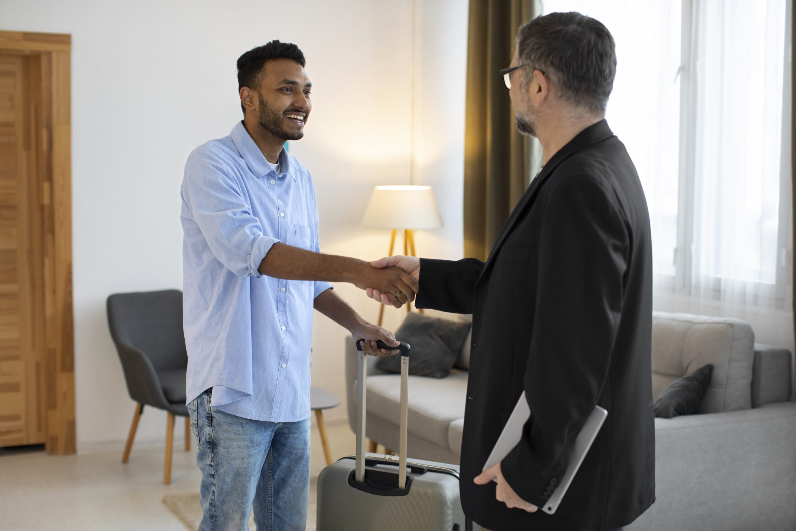 side view men shaking hands scaled